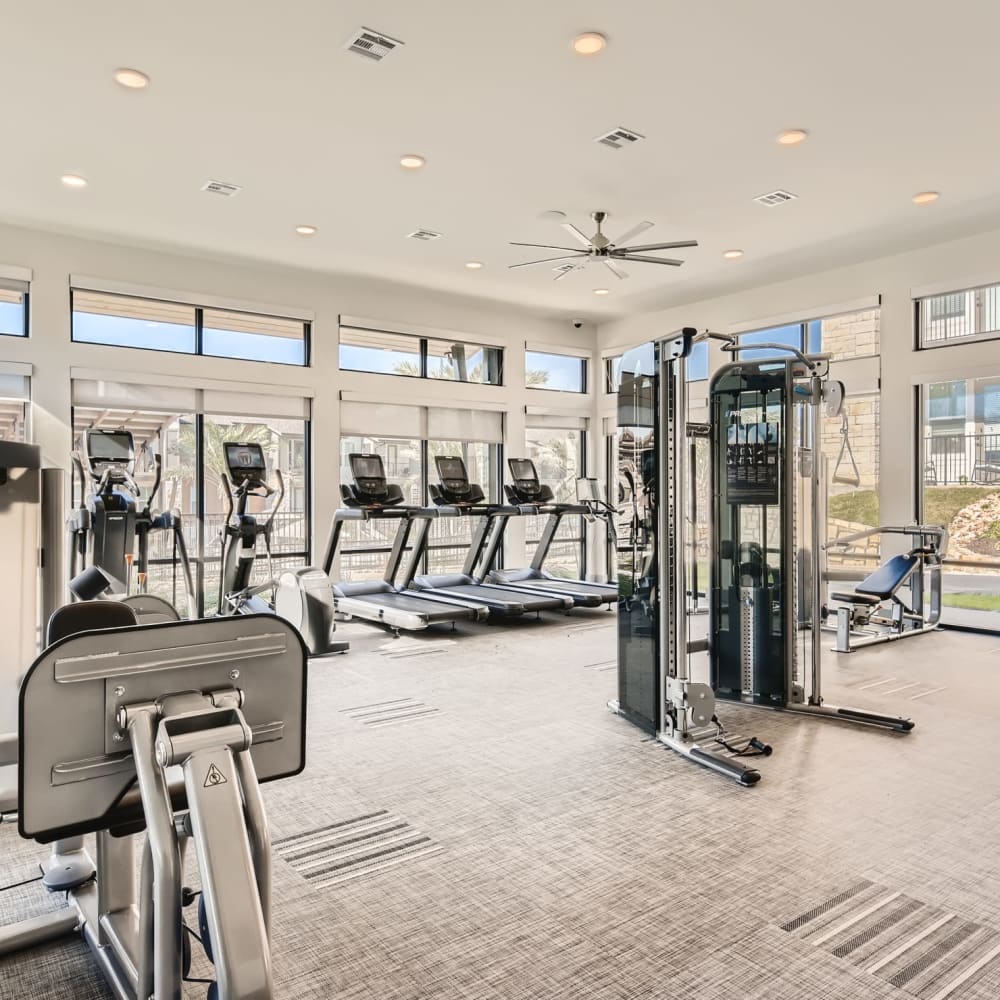 Modern equipment in the fitness center at Cypress McKinney Falls in Austin, Texas