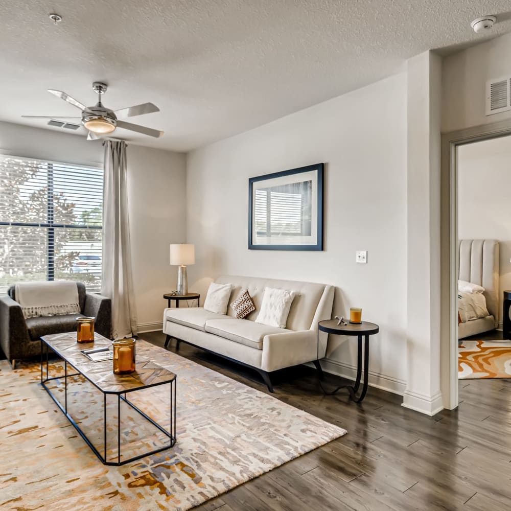 Wood flooring in a furnished apartment living room and bedroom at EOS in Orlando, Florida