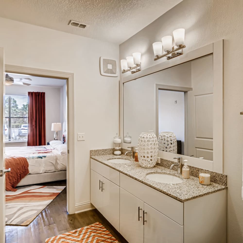 A bathroom connected to the main bedroom of an apartment at EOS in Orlando, Florida