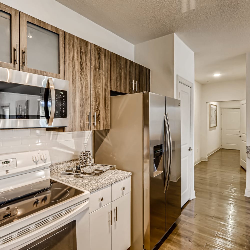 Stainless steel and upgraded kitchen cabinets in an apartment at EOS in Orlando, Florida