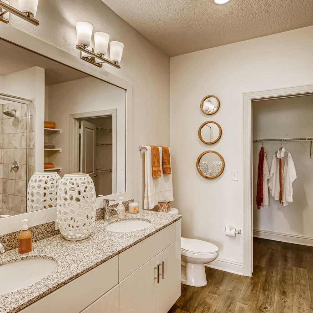 A double sink in a bathroom with an attached closet at EOS in Orlando, Florida