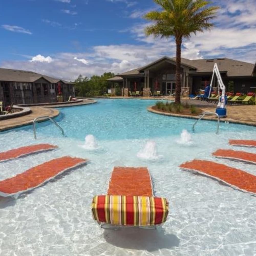 Lounge seating in the community swimming pool at Retreat at Fairhope Village in Fairhope, Alabama