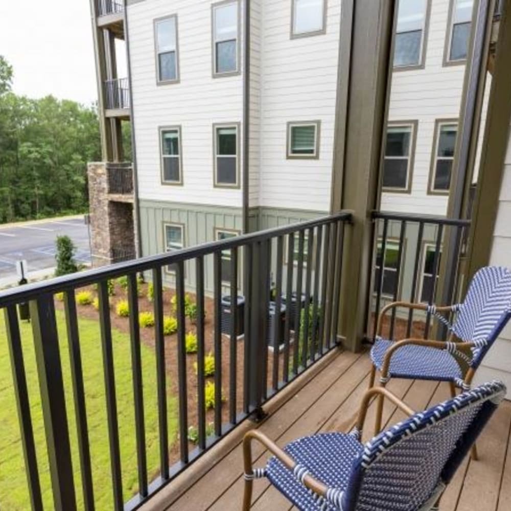 Outdoor seating on a balcony at Retreat at Fairhope Village in Fairhope, Alabama