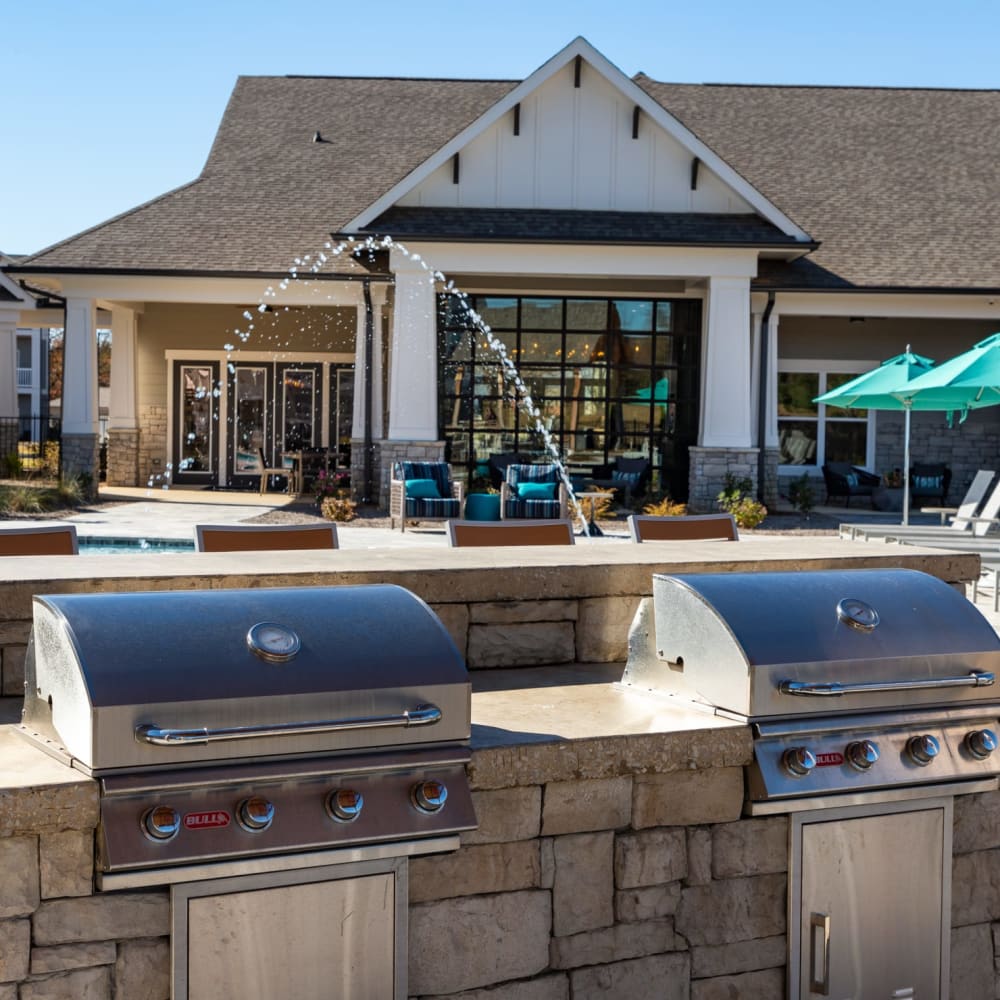 Outdoor grilling stations by the pool at The Alexandria in Madison, Alabama