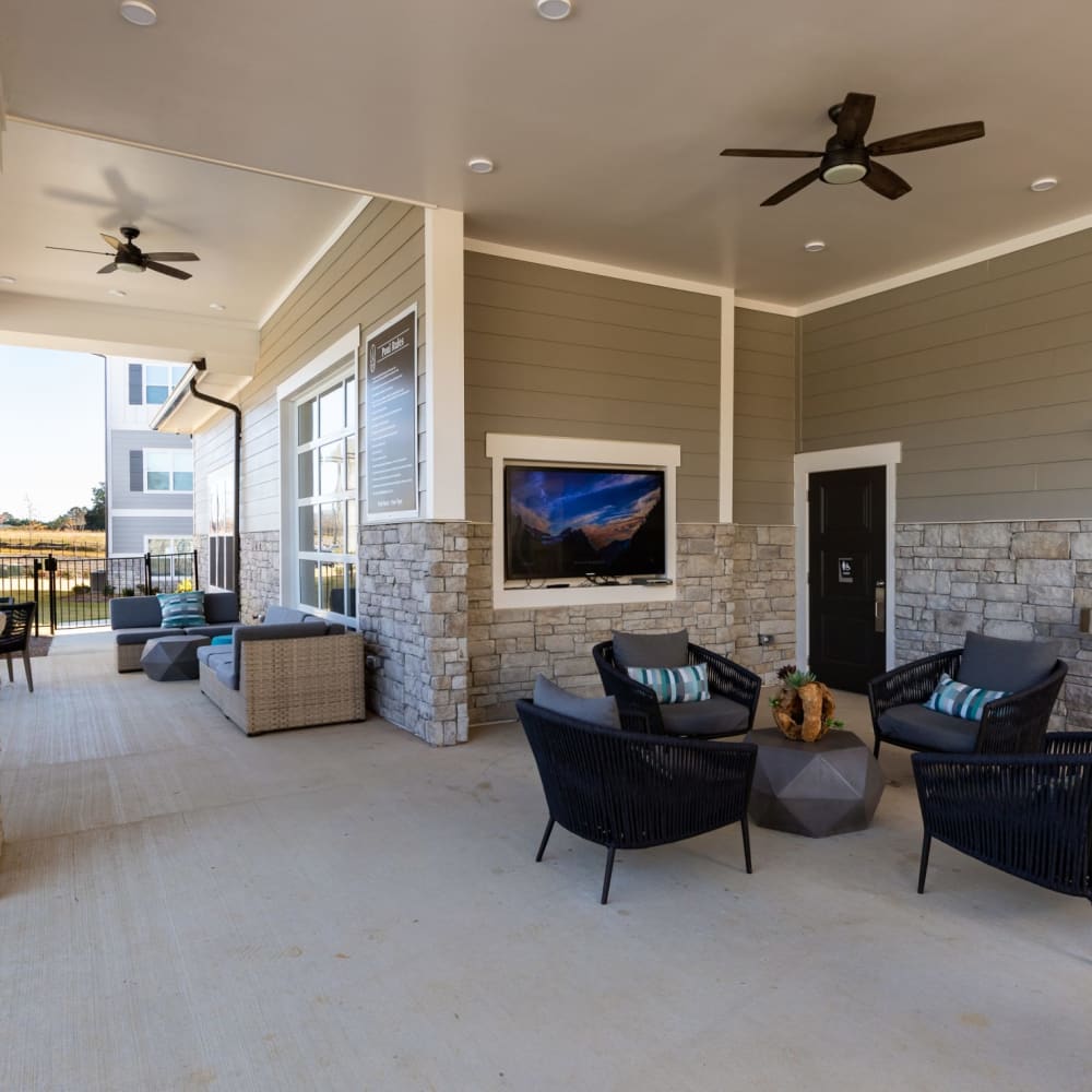 Covered outdoor seating with ceiling fans at The Alexandria in Madison, Alabama