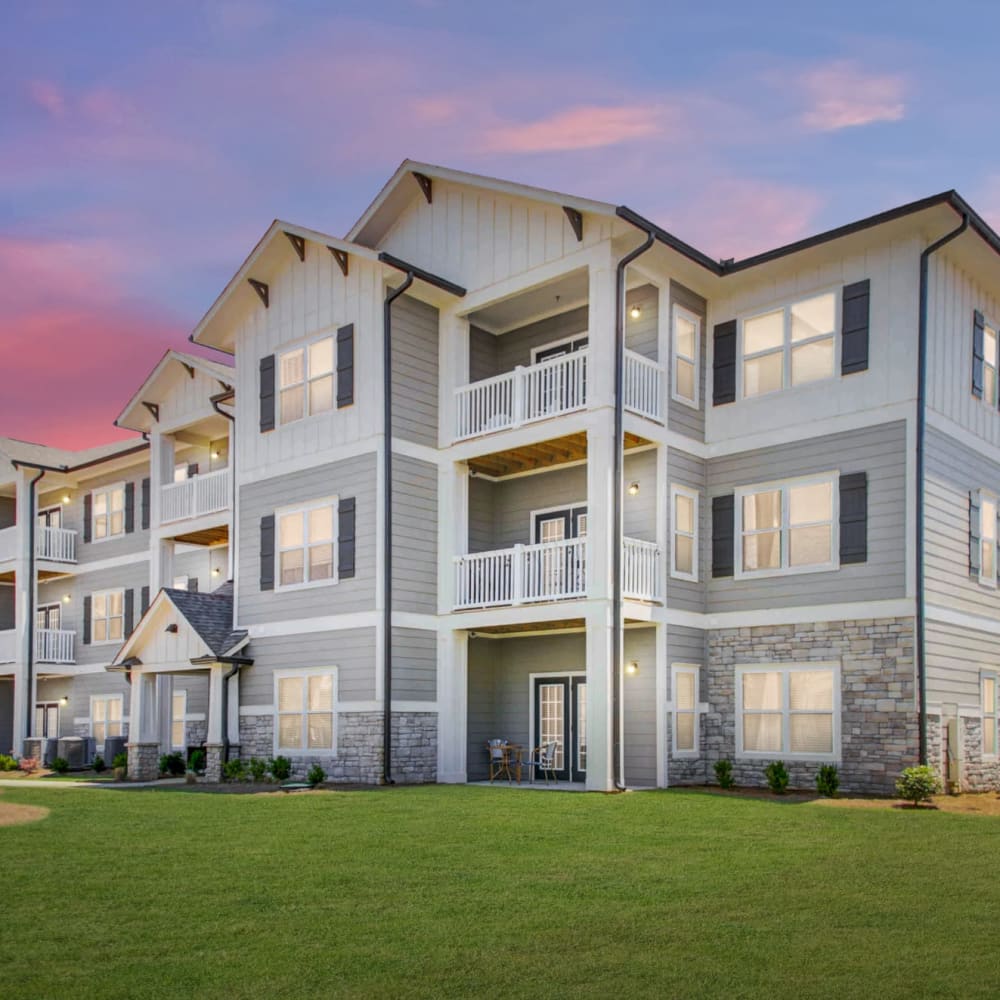 Exterior of an apartment building at dusk at The Alexandria in Madison, Alabama