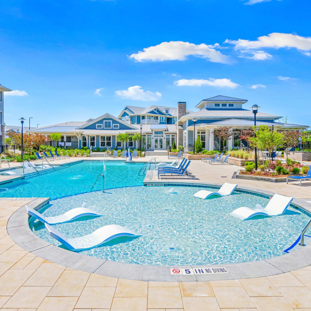 Lounge seating in the community swimming pool at The Highland in Augusta, Georgia