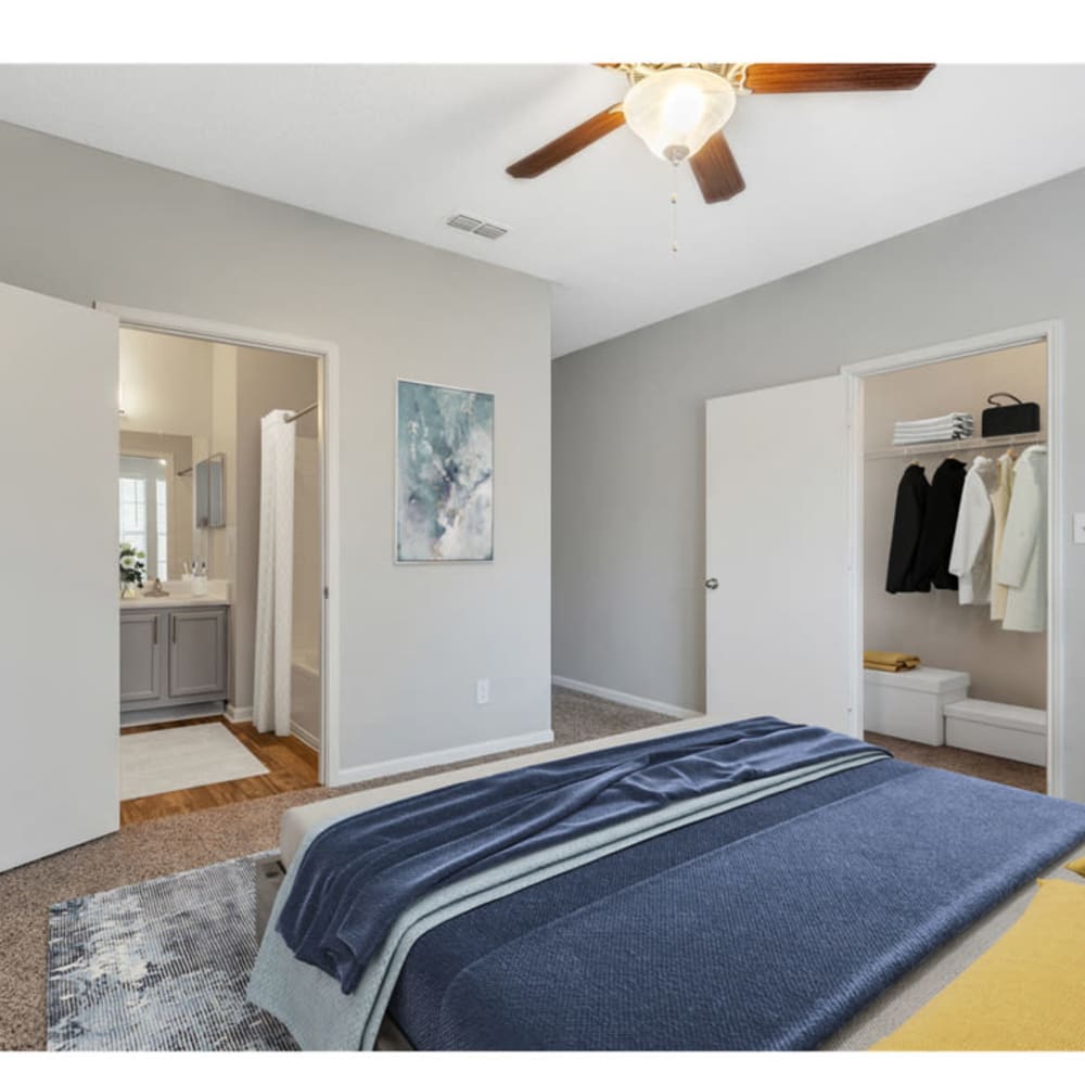 A spacious, furnished apartment bedroom with a large closet at Astoria in Mobile, Alabama