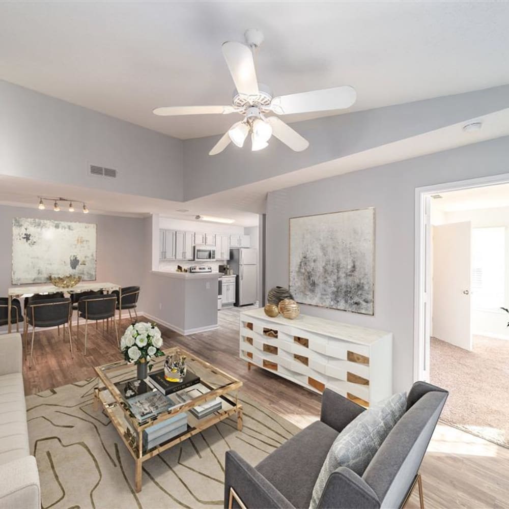 An apartment living room leading to the main bedroom at Astoria in Mobile, Alabama