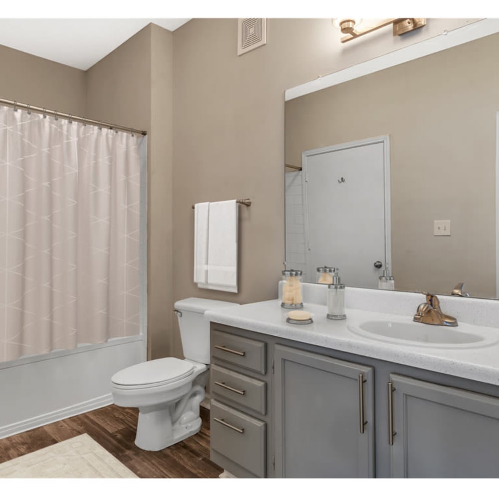 An apartment bathroom with a large tub at Astoria in Mobile, Alabama