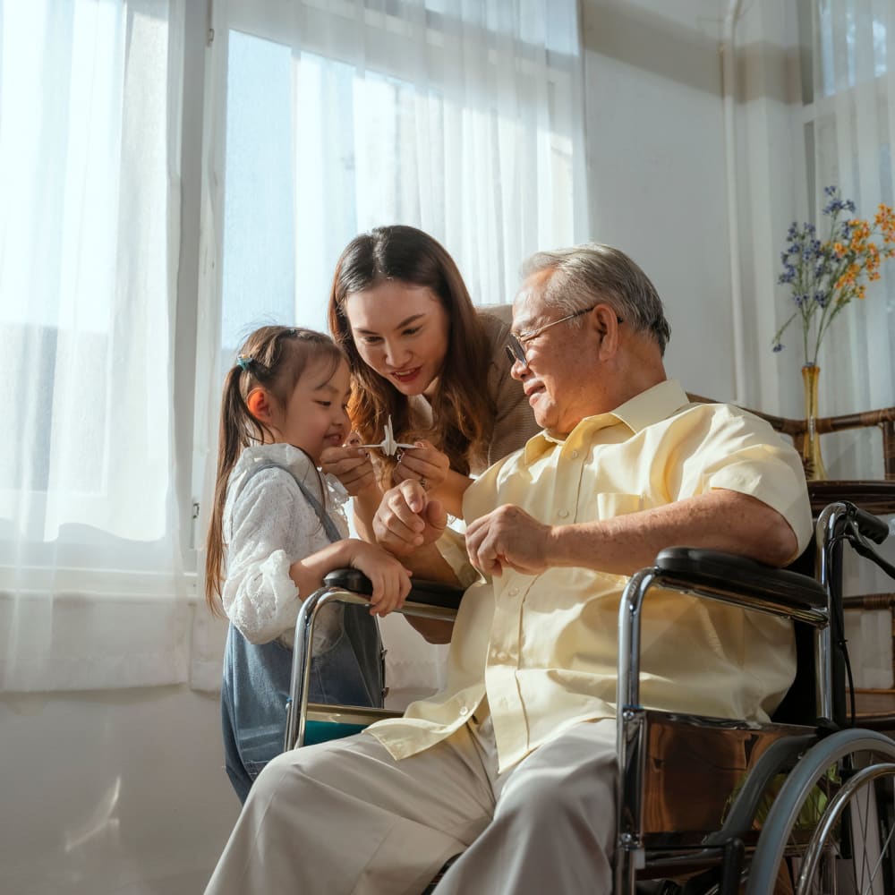 A resident and his grandchildren at Ridge at Frisco in Frisco, Texas