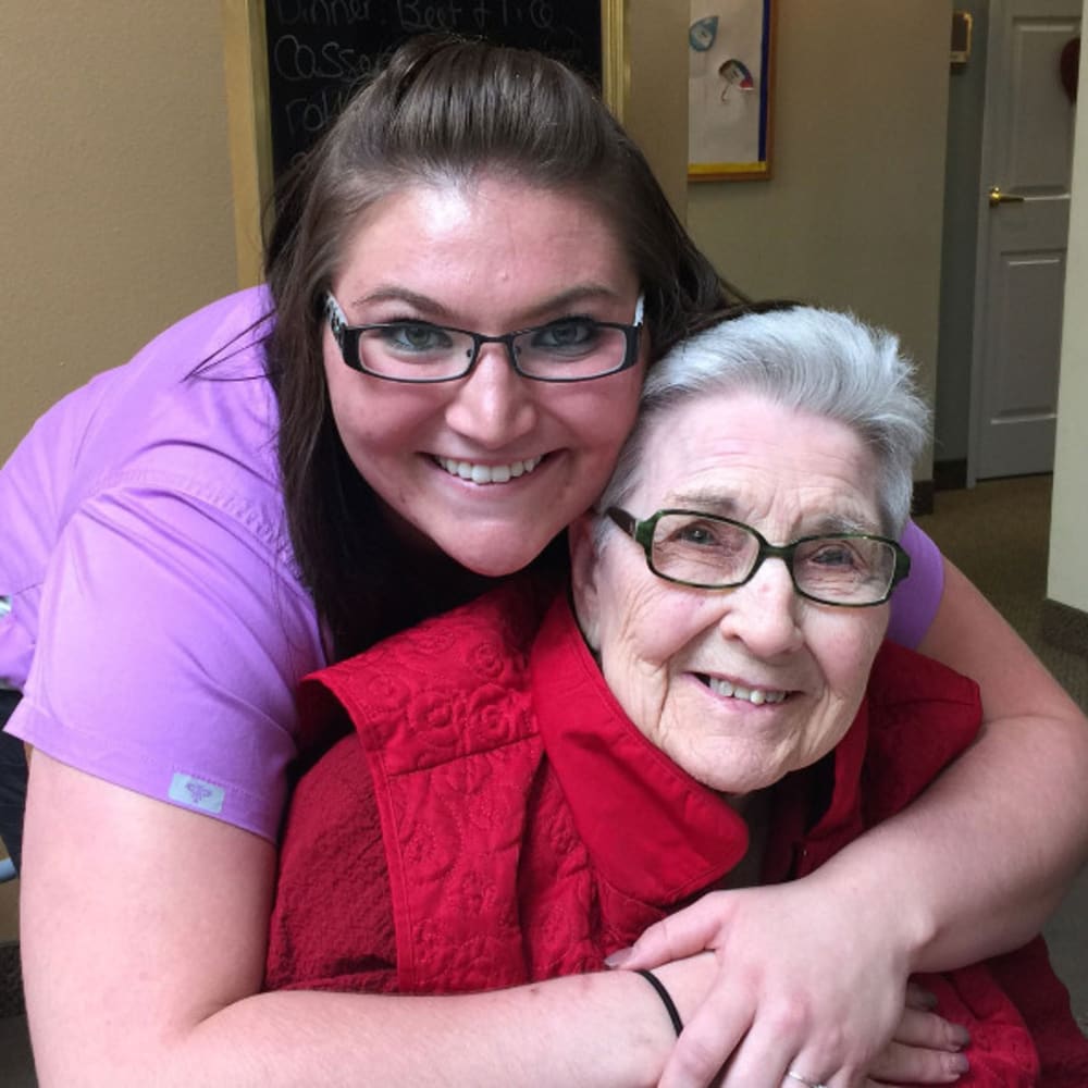 Two smiling residents at The Peaks at South Jordan Memory Care in South Jordan, Utah