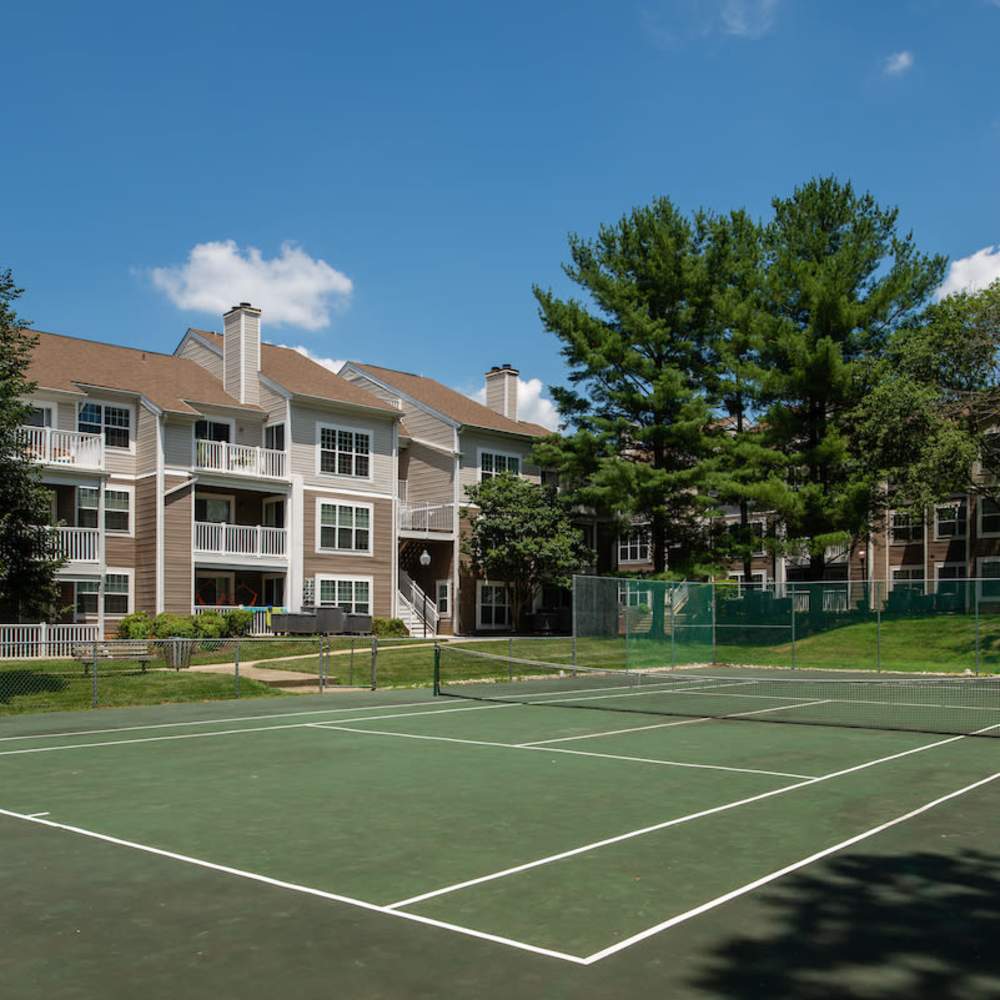 Fenced tennis court at The Elms at Oakton in Fairfax, Virginia