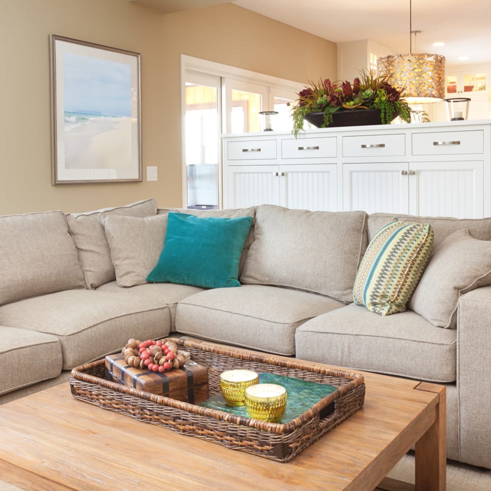 A sectional couch in a furnished apartment living room at Mode at Hyattsville in Hyattsville, Maryland