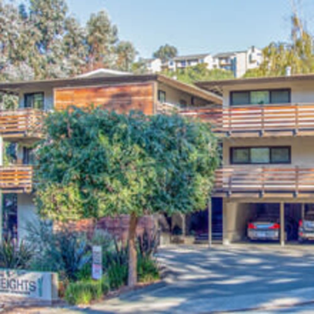 Exterior with brown siding and covered parking at our Heights at 109 community at Mission Rock at Novato in Novato, California