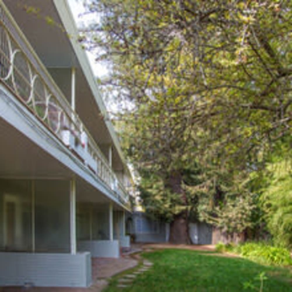 Exterior of community featuring private patios and green space at our Glenwood community at Mission Rock at Novato in Novato, California