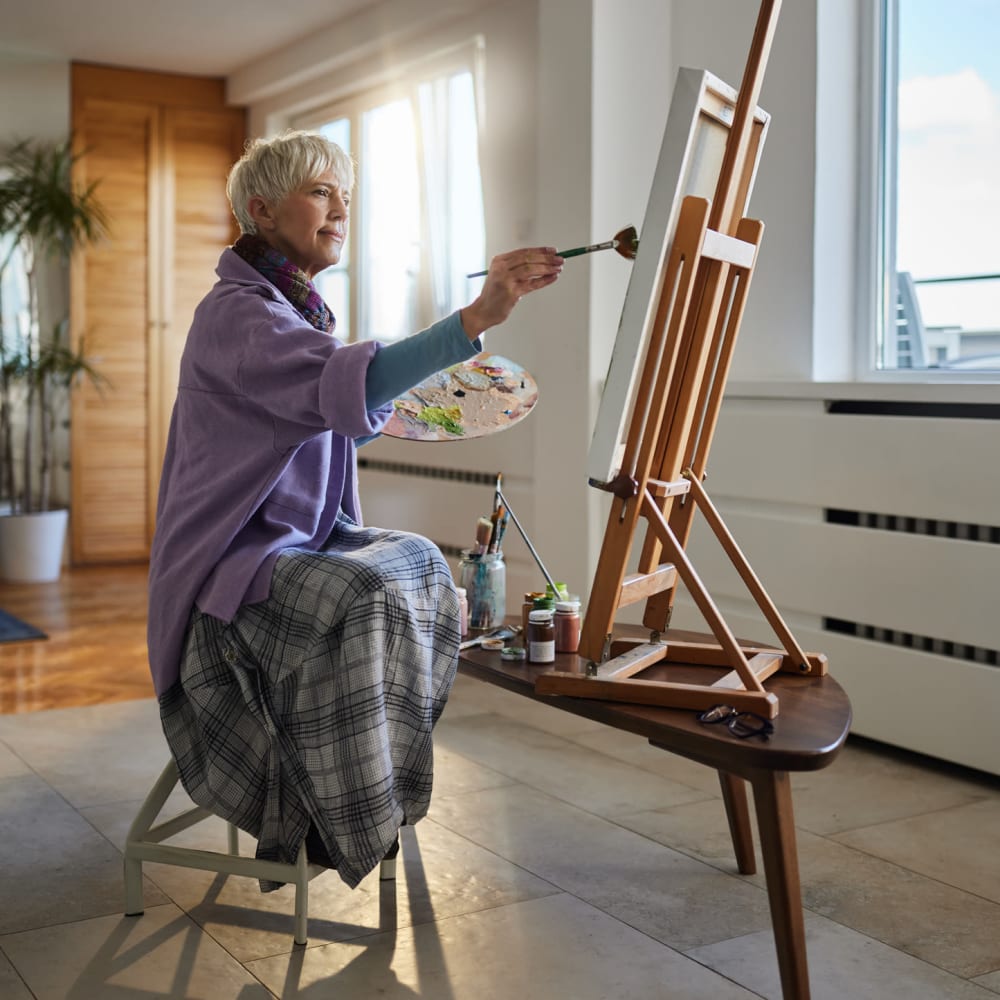 Resident painting at Kauai Care Center in Waimea, Hawaii