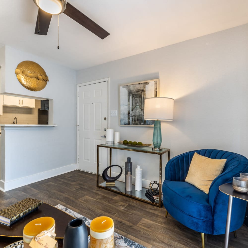 Resident living area with ceiling fan at The Grove in Houston, Texas