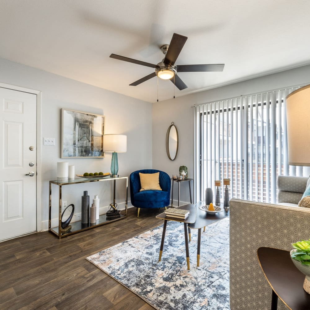 Resident living space with wood-style flooring at The Grove in Houston, Texas