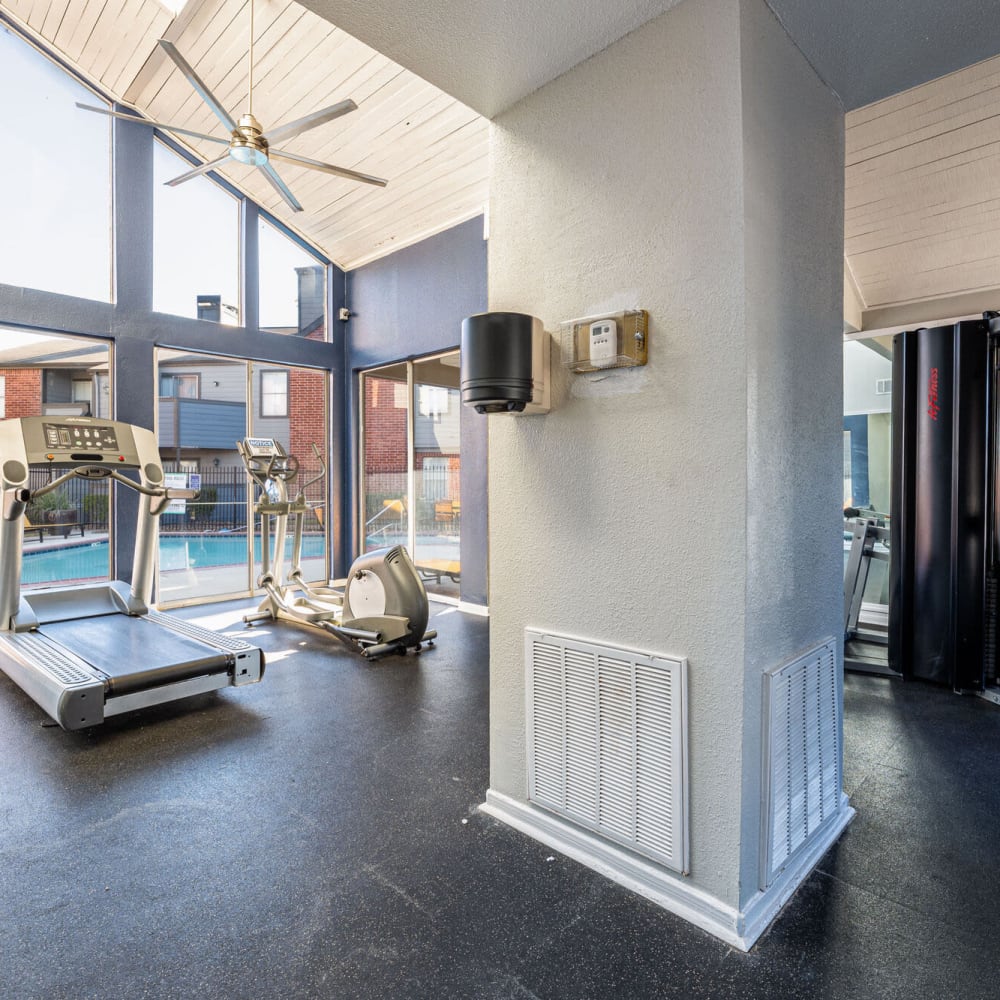 Fitness center with pool views at The Linc at Cypress in Houston, Texas