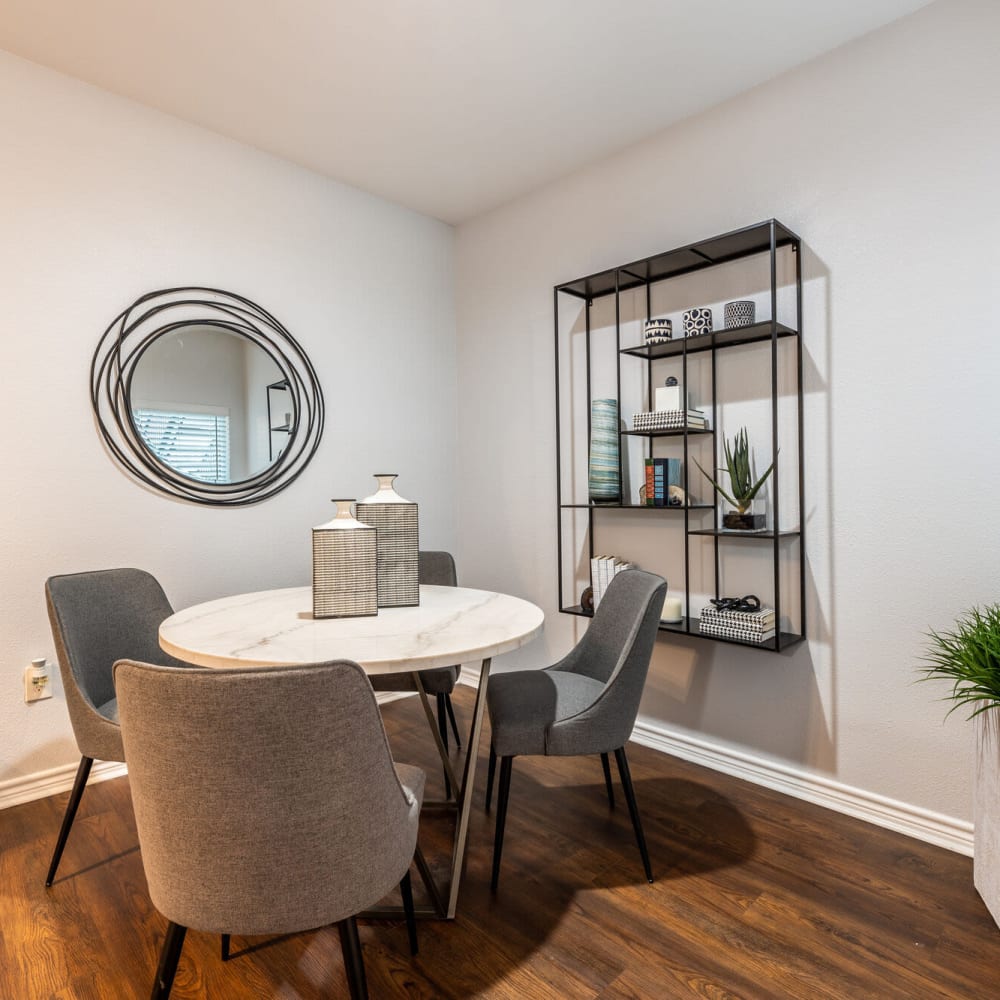 Dining area featuring table and chairs at Lakebridge Apartments in Houston, Texas