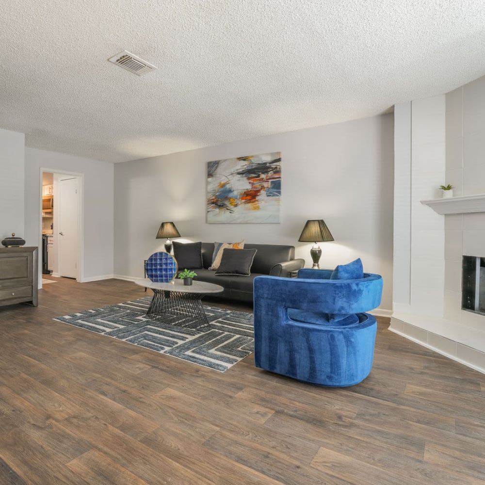Living room with beautiful wood-style flooring at Lakebridge Townhomes in Houston, Texas