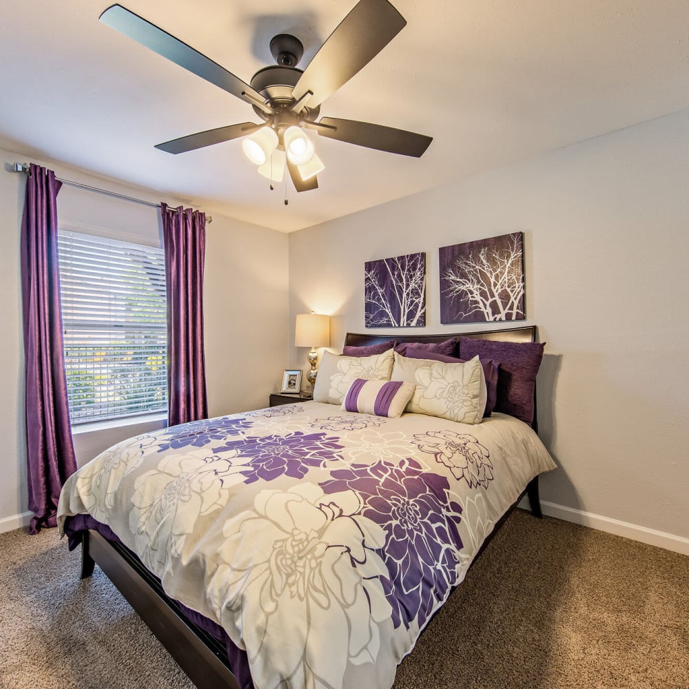 Bedroom with great natural lighting and a ceiling fan at The Domain at Ellington in Houston, Texas