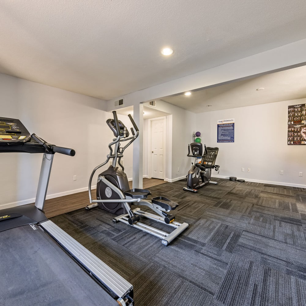 Fitness center with carpeting at The Domain at Ellington in Houston, Texas
