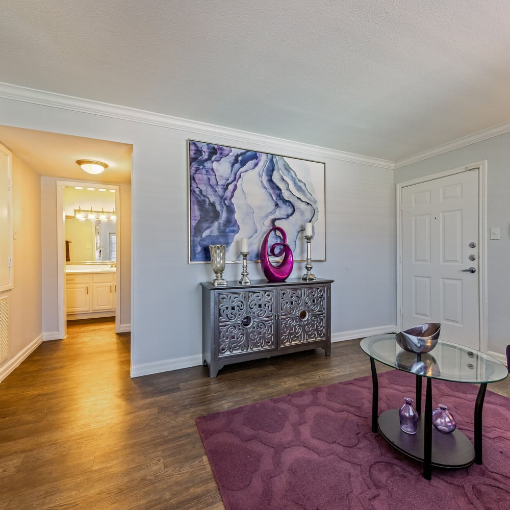 Living space with wood-style flooring at The Domain at Ellington in Houston, Texas