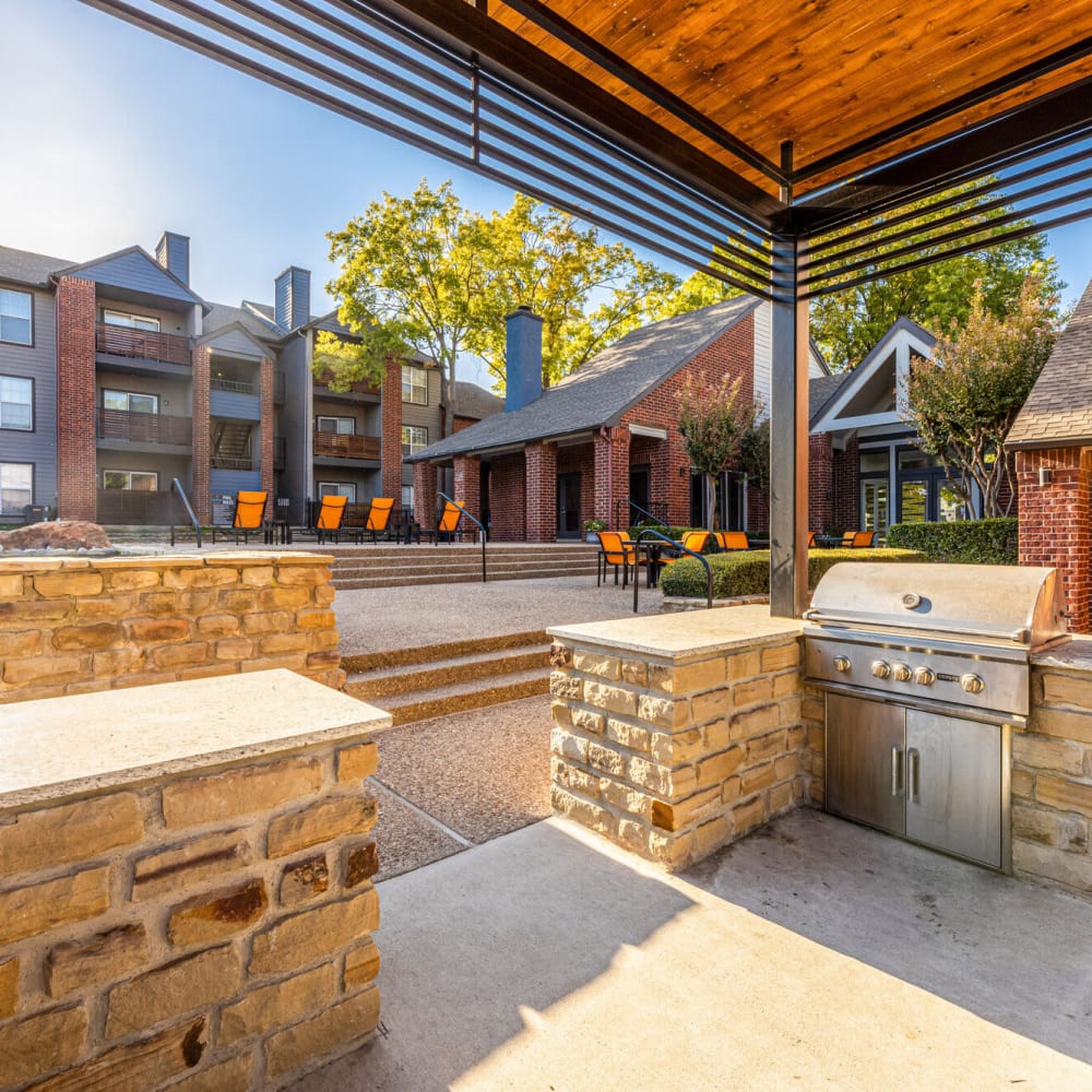 Covered barbequing areas at The Bradford on the Park in Bedford, Texas
