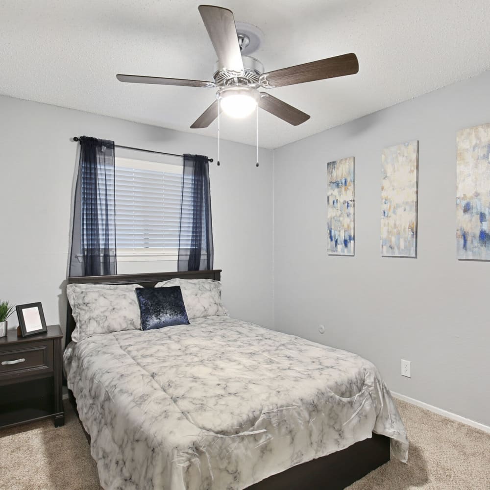Resident bedroom with ample natural light at The District on Collins in Arlington, Texas