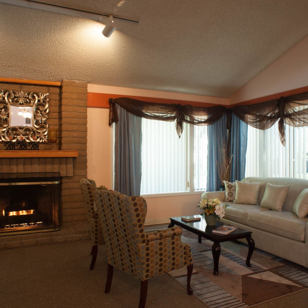 Model living room with a fire place at The Grove in Ontario, California