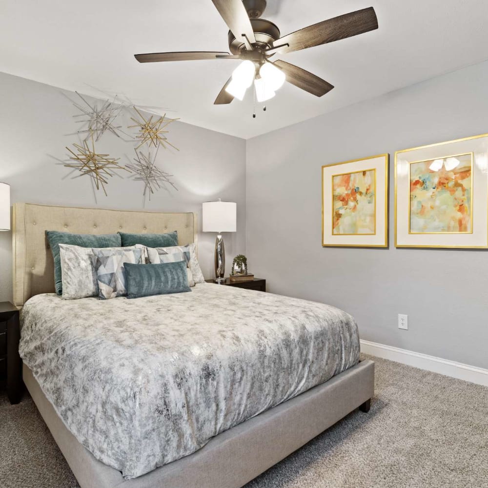 Decorated second bedroom with plush carpeting at The Haven on Chisholm Trail in Fort Worth, Texas