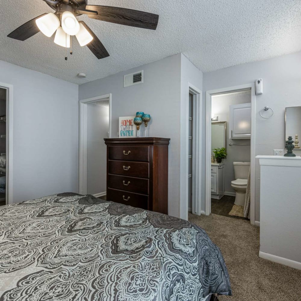 Bedroom with ceiling fan at The Landing at Clear Lake in Webster, Texas