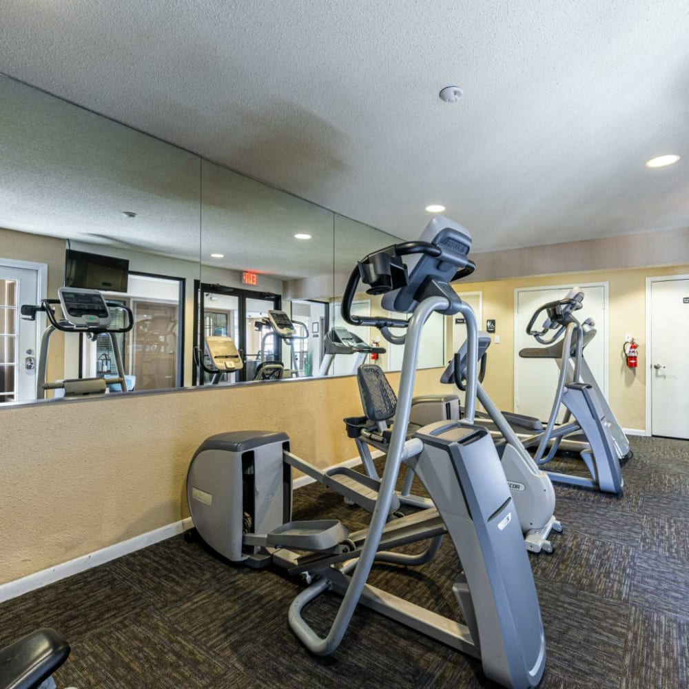Fitness center with stair-steppers at The Landing at Clear Lake in Webster, Texas