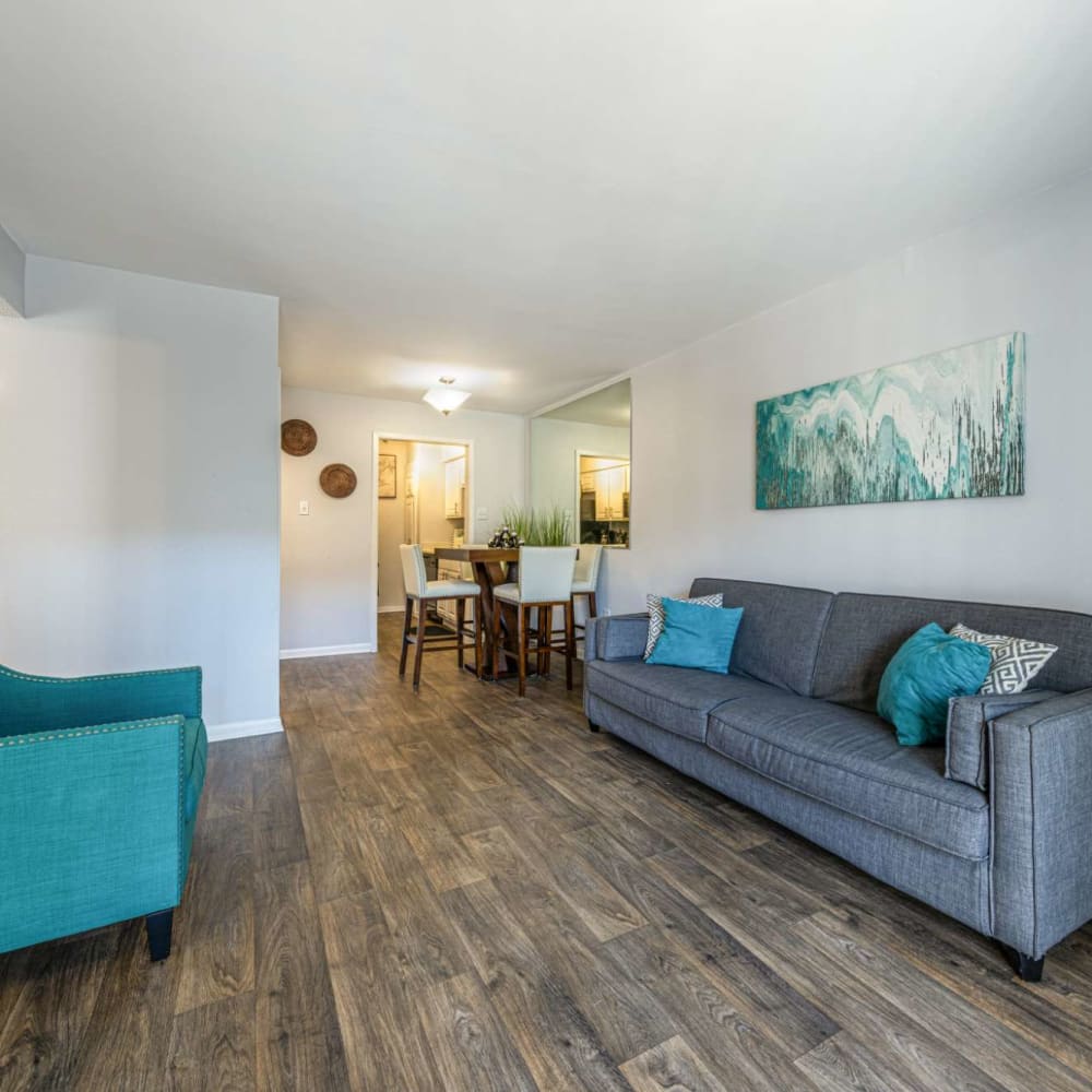 Living space with wood-style flooring at The Landing at Clear Lake in Webster, Texas