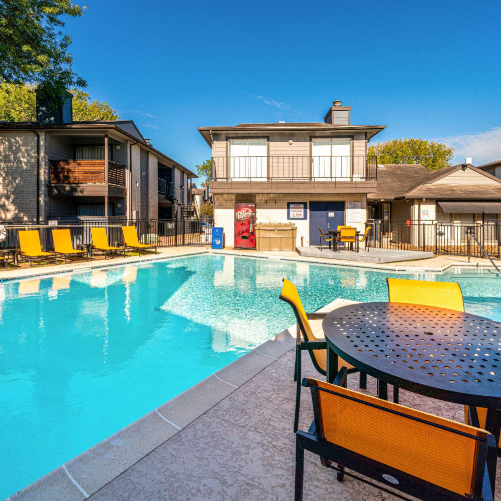 Resident pool with lots of gathering space at The Legacy at Clear Lake in Webster, Texas