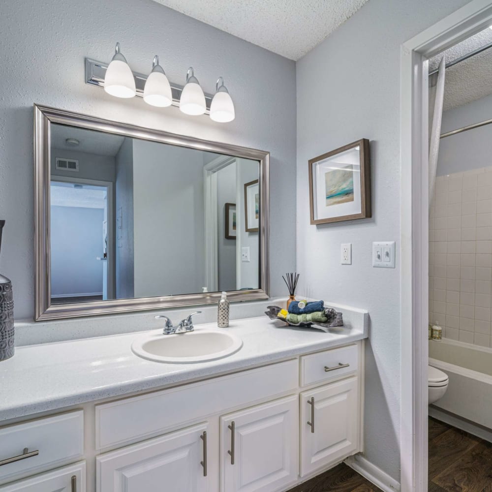 Bathroom with great lighting at The Legacy at Clear Lake in Webster, Texas