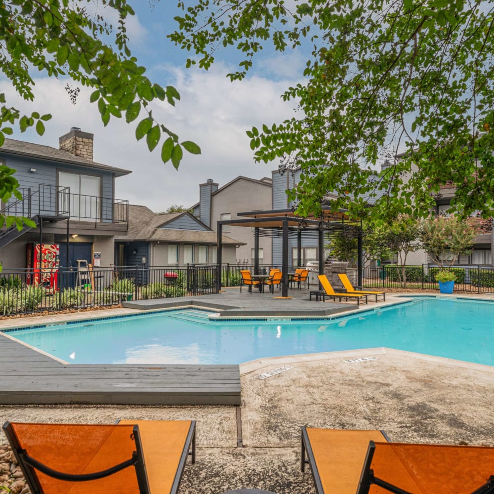 Swimming pool with lounge seating at The Parker at Ellington in Houston, Texas