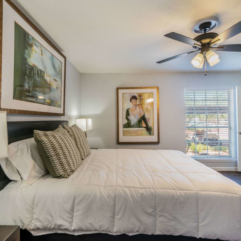 Bedroom with ceiling fan at Waterside Apartments in Houston, Texas