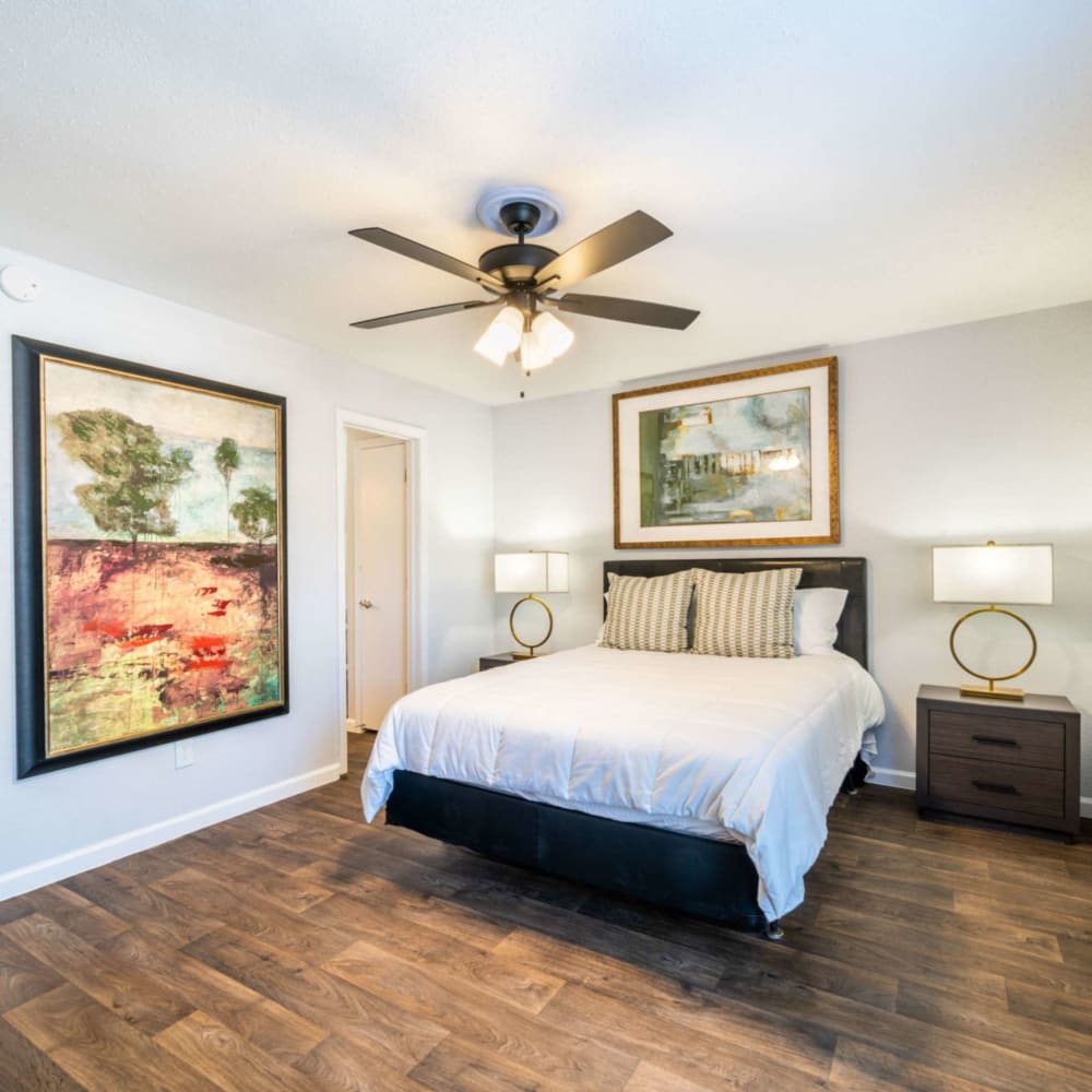 Bedroom with wood-style flooring at Waterside Apartments in Houston, Texas