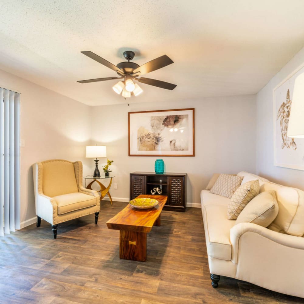 Living space with wood-style flooring at Waterside Apartments in Houston, Texas