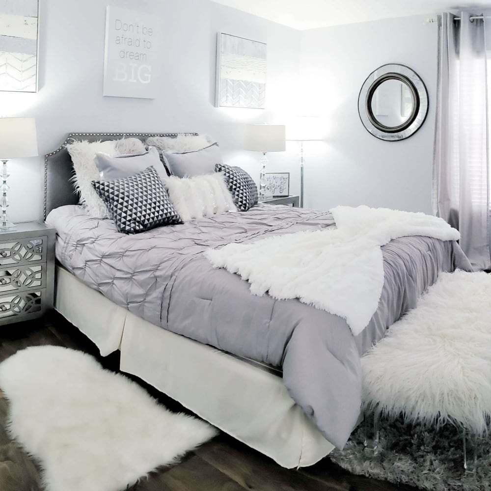 Bedroom with wood-style flooring at Carrara at Cypress Creek in Spring, Texas