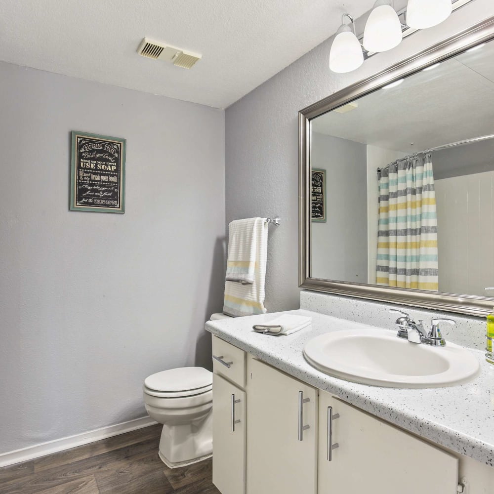 Bathroom with wood-style flooring at The Hub at Chisolm Trail in Fort Worth, Texas