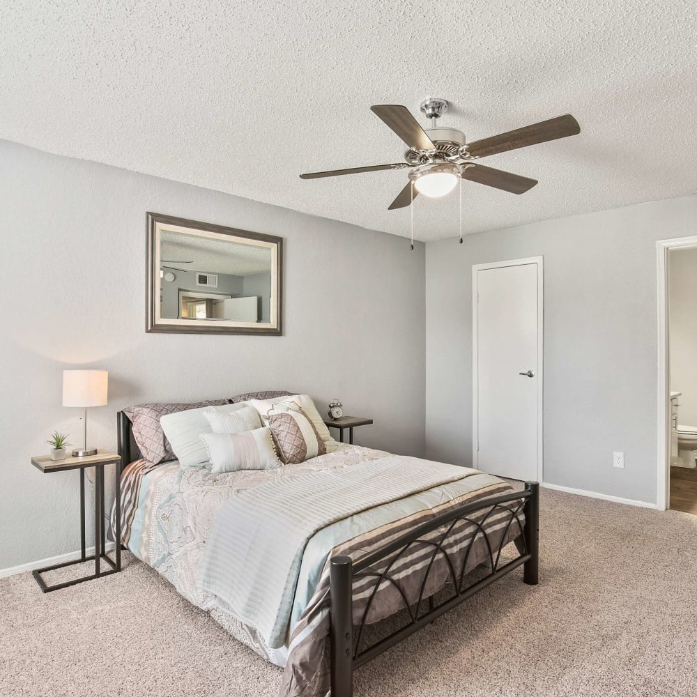 Bedroom with plush carpeting at The Hub at Chisolm Trail in Fort Worth, Texas