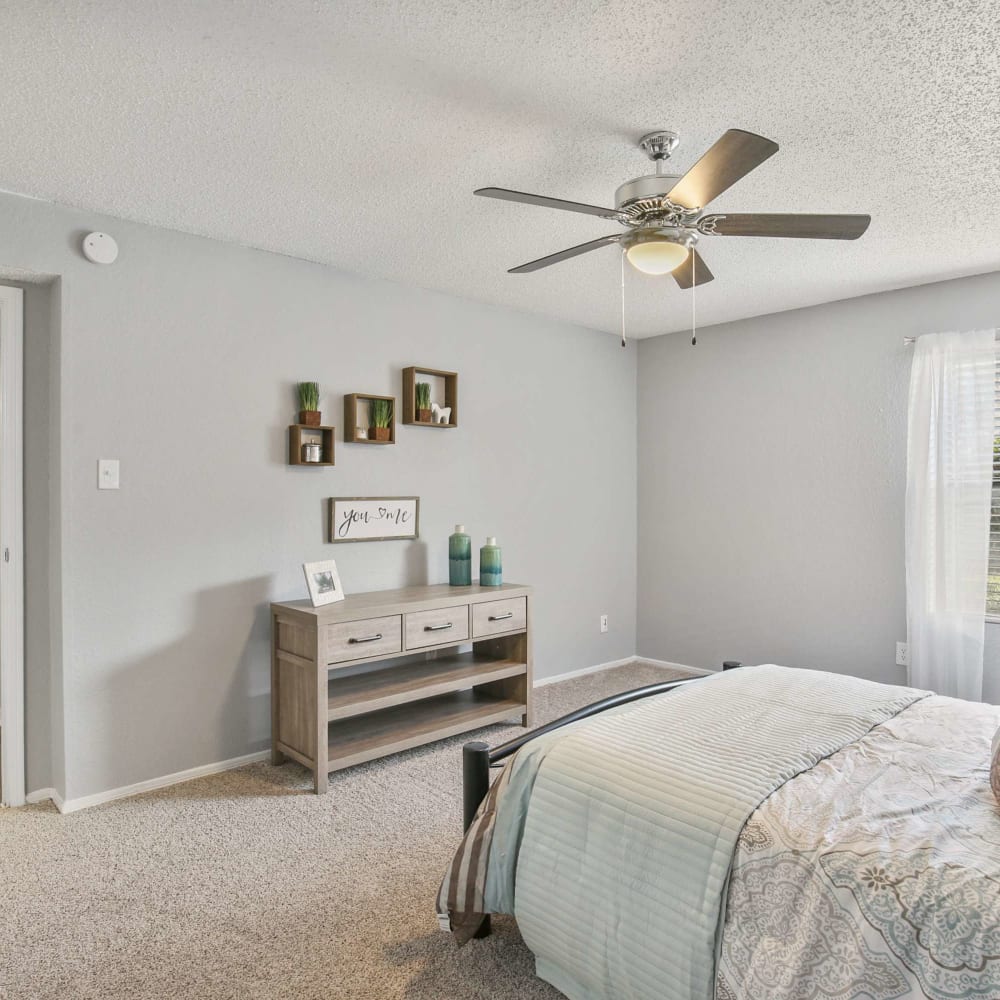 Bedroom with ceiling fan at The Hub at Chisolm Trail in Fort Worth, Texas