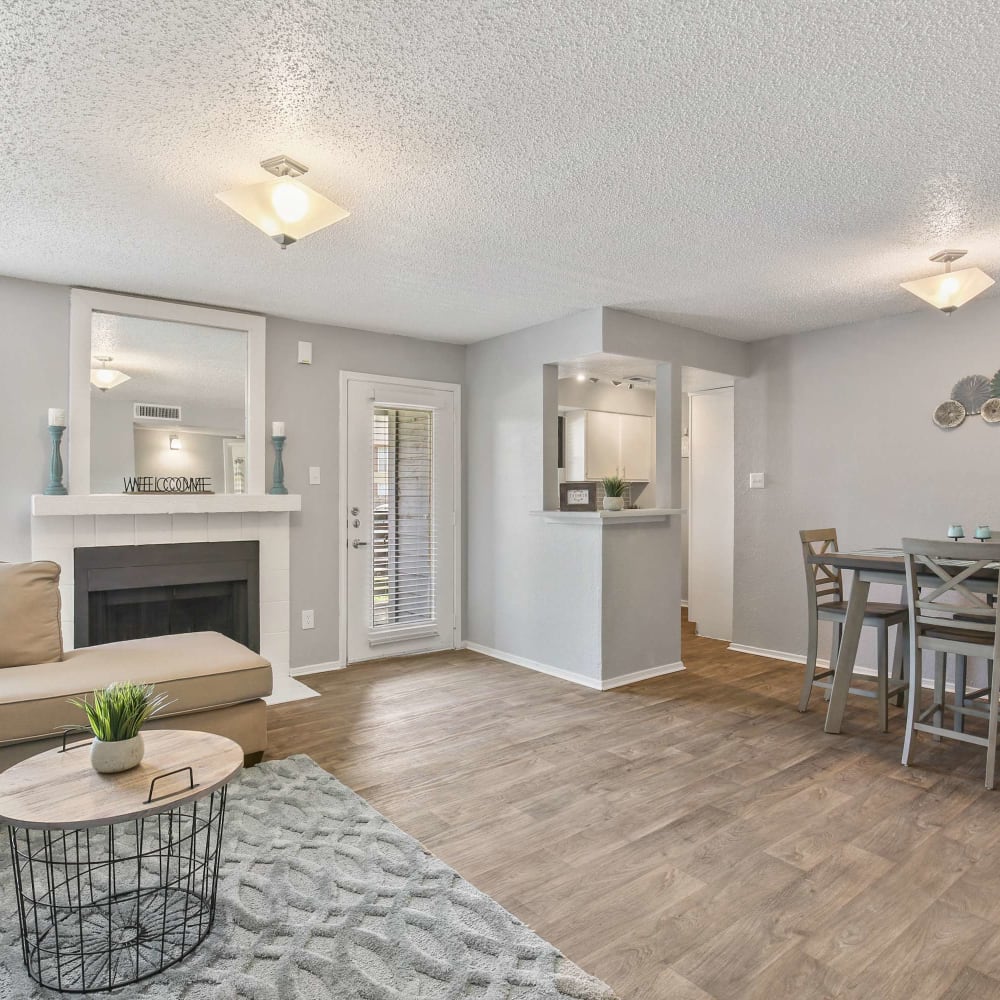 Open living space with wood-style flooring at The Hub at Chisolm Trail in Fort Worth, Texas