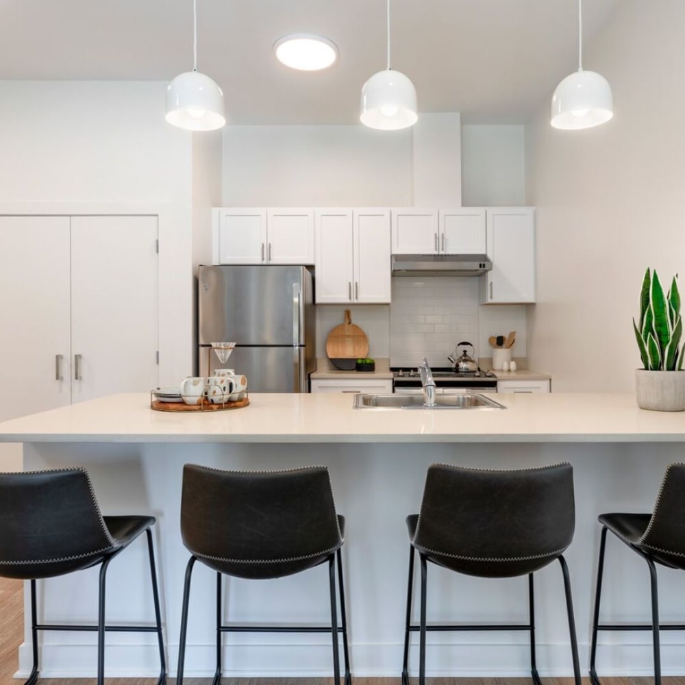 Model kitchen with counter seating at Metro Green Court in Stamford, Connecticut