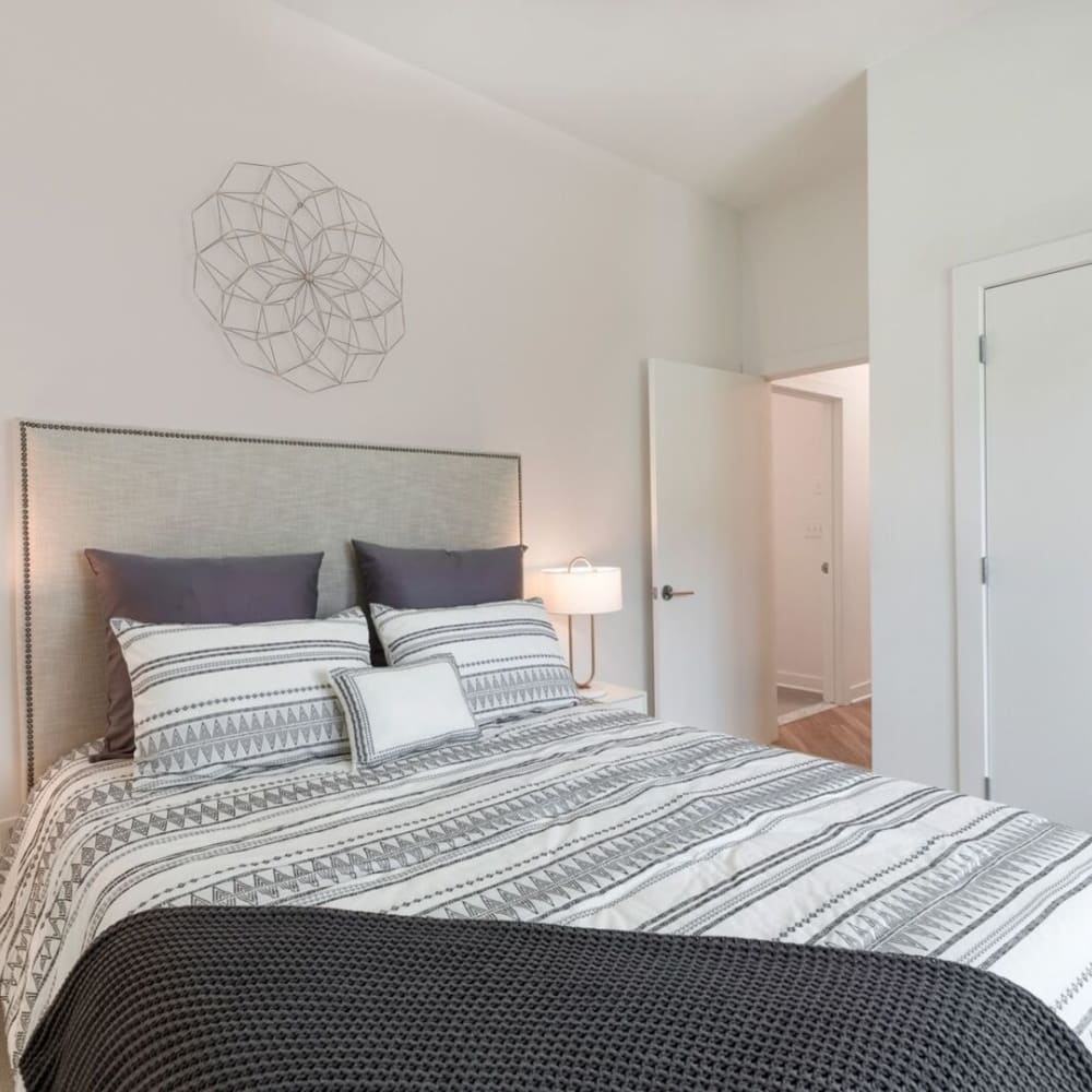 Model bedroom with gray accents at Metro Green Court in Stamford, Connecticut