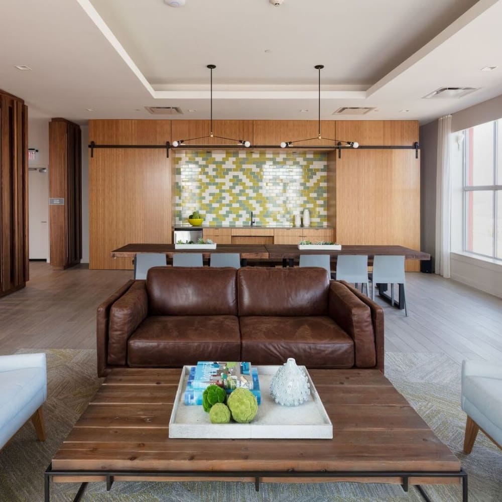 Gathering area with leather couches at Metro Green Court in Stamford, Connecticut